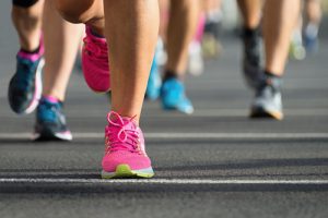 photo of people in running shoes from the knee down