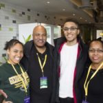 A Mason students celebrates family weekend with her mother, father, and brother