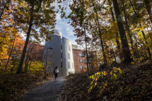 student climbing hill to observatory