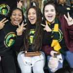 Three young women at Homecoming 2019. Photo by: Ron Aira/Creative Services/George Mason University