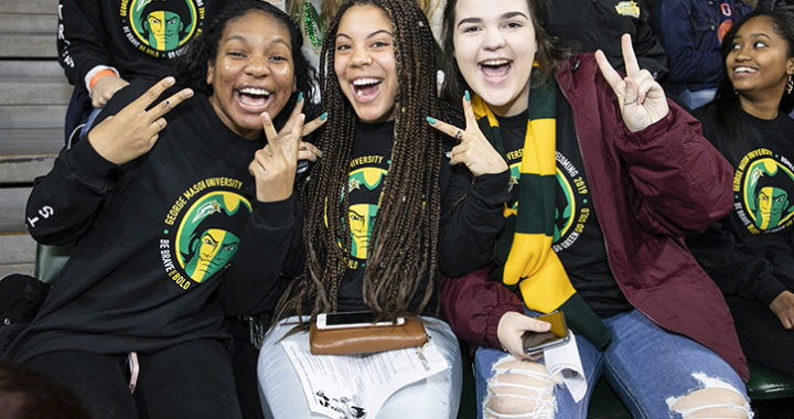 Three young women at Homecoming 2019. Photo by: Ron Aira/Creative Services/George Mason University