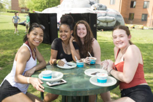Students enjoying the warm weather at Parkapalooza in President's Park. (Bethany Camp/Creative Services/George Mason University)