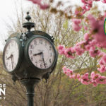clock with flowering trees