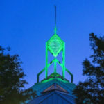 Spire on the JC lit in green
