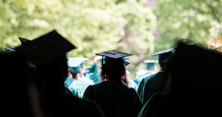 students at graduation in silhouette