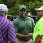 Gregory Washington visits with participants before the 25th Annual Diversity Scholarship Golf Classic. Photo by: Shelby Burgess/Strategic Communications/George Mason University, Gregory Washington