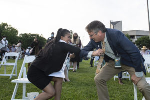 Fairfax County Schools Superintendent Scott Braband congratulates Early Identification Program senior graduates at the EIP recognition ceremony on the George Mason University Fairfax Campus. photo by Evan Cantwell/Creative Services