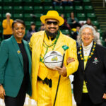 Interim Athletic Director Nena Rogers (from left), Green Machine Ensembles Director Michael "Doc Nix" Nickens, and Linda West Nickens, his mother.