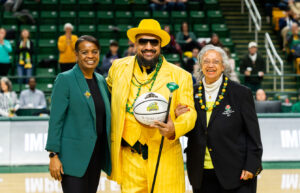 Interim Athletic Director Nena Rogers (from left), Green Machine Ensembles Director Michael "Doc Nix" Nickens, and Linda West Nickens, his mother.
