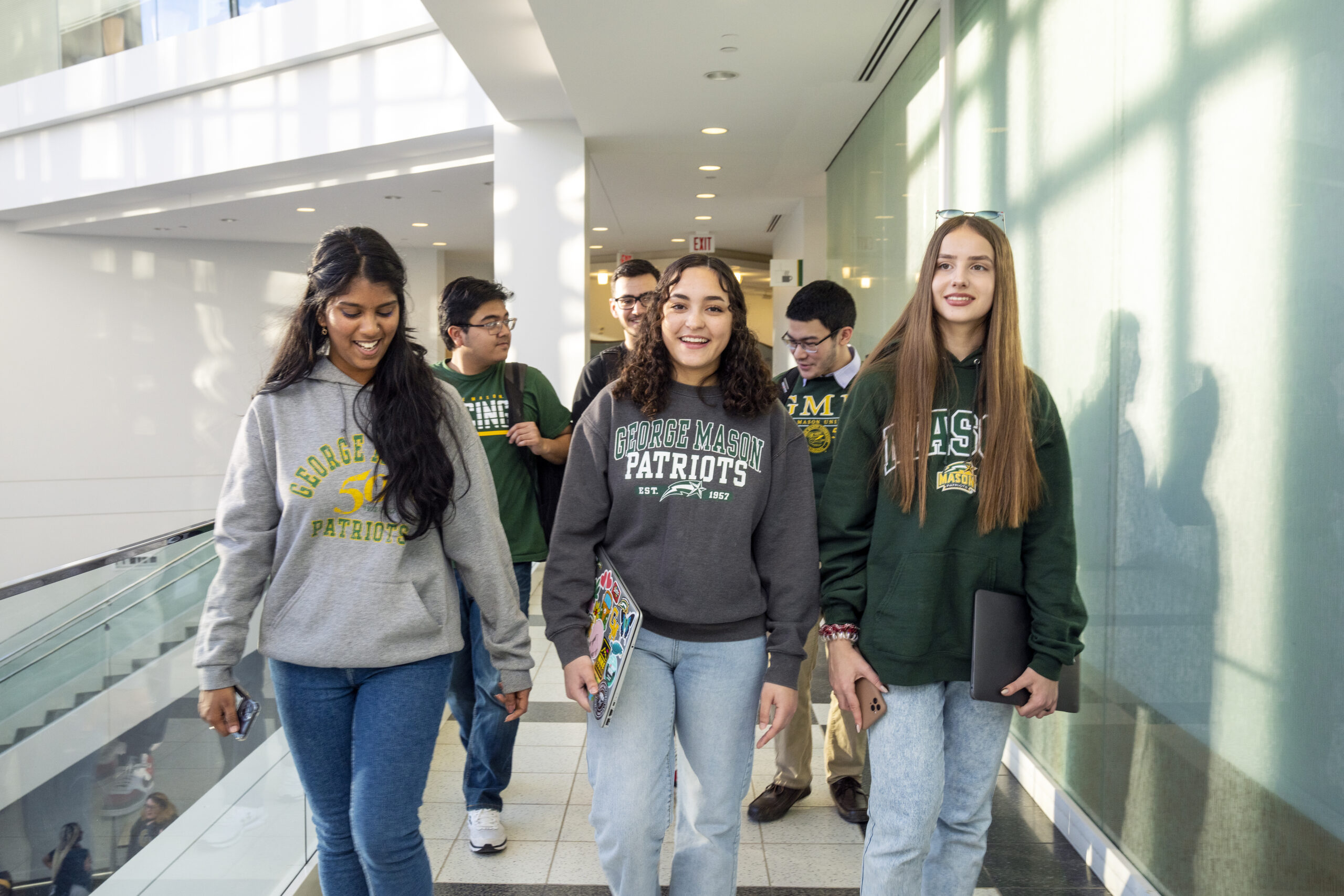Patriot leaders from the New Student and Family Programs office pose for photos on campus. Photo by Evan Cantwell/Creative Services
