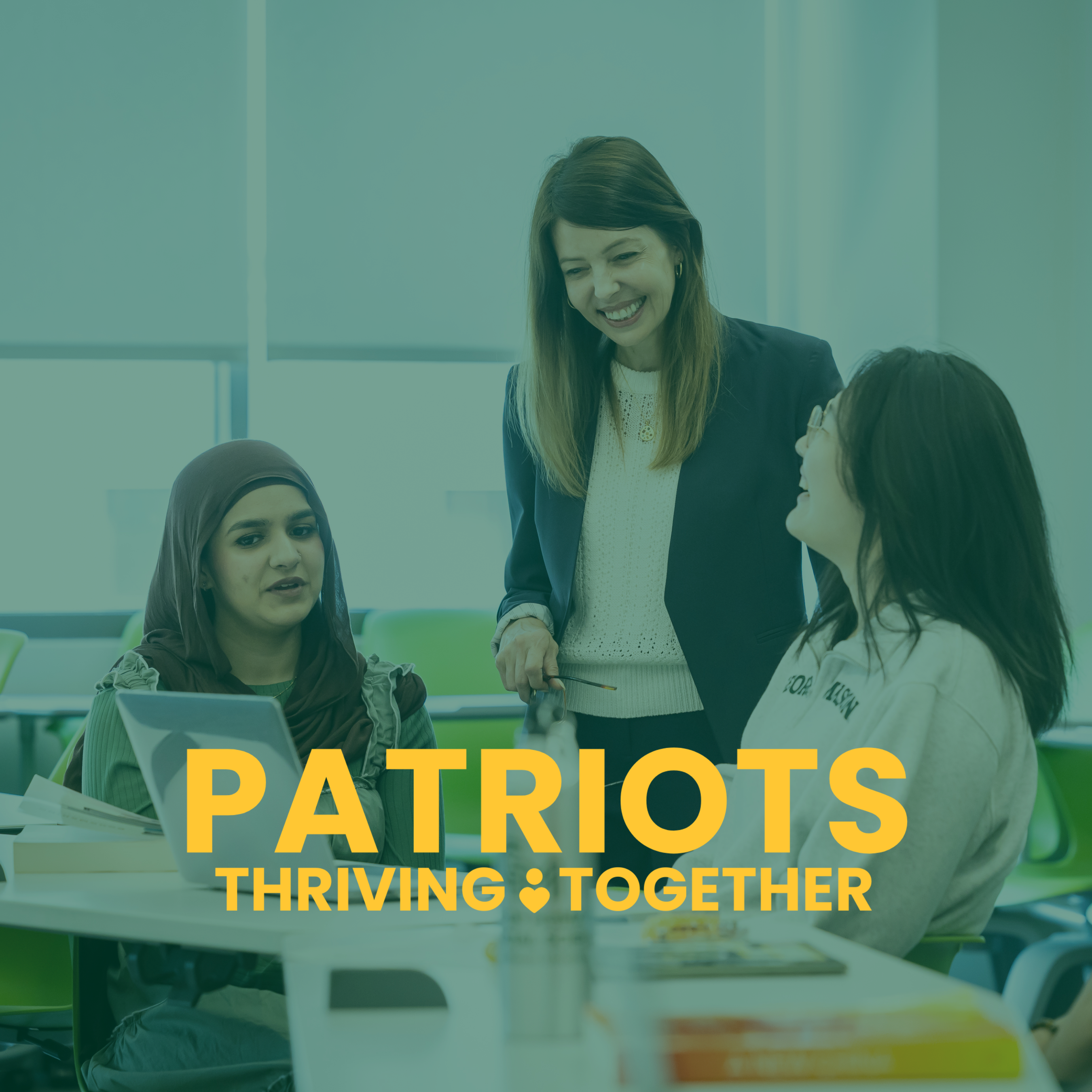 George Mason Students and Faculty laughing together in classroom setting. Patriots Thriving Together logo lays on top of the photo centered towards the bottom.